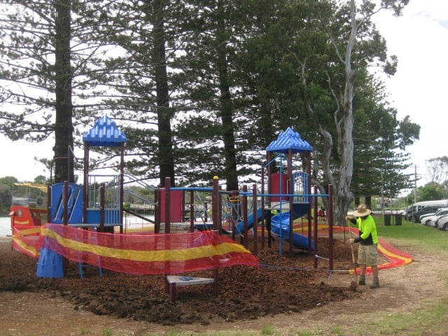 The Banner Park playground received some new bark ground cover yesterday. But the old gum tree popular with locals near it which is a home for parrots and other birds, will be axed to make way for a huge deck and enlarged playground.