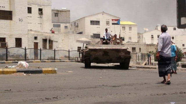 Southern Yemenis stand atop a tank of tribal militiamen loyal to Yemeni president Abdo Rabbo Mansour Hadi following clashes with Houthi fighters in the southern port city of Aden, Yemen, on Wednesday. Local sources in Aden reported fierce fighting as army units allied to the Houthis tried to advance on areas held by pro-Hadi militias. EPA