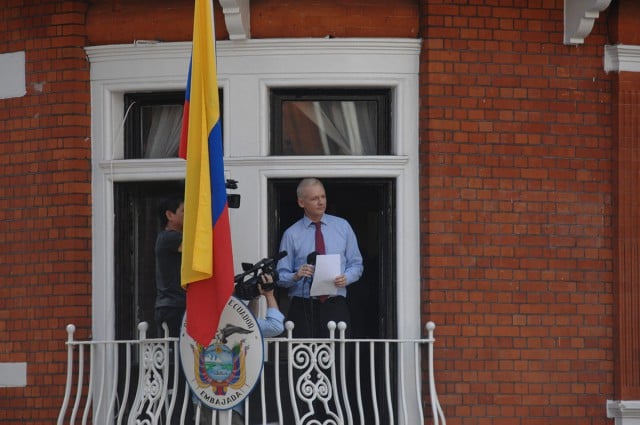 Julian Assange speaks from a balcony in the Ecuadorian embassy in London in 2012. Photo Snapperjack flickr.com/people/7199534@N06