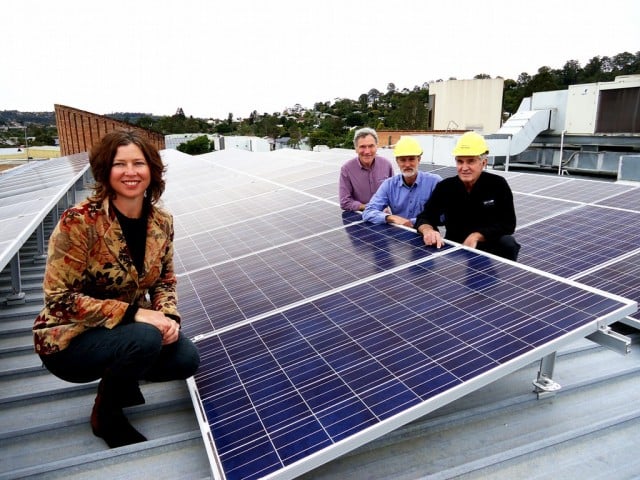 Sustainable House Day Seminar and Trade Show organiser, Lismore City Council's Vanessa Tallon, shows off the Lismore Workers Club's new solar array with energy educator Colin George, solar energy consultant Michael Qualmann and Lismore Workers Club president Richard Mackney.