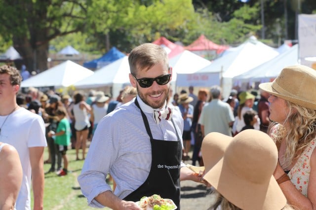 Adam from the Unexpected Guest enjoys lunch at Saturday's annual Sample Food Festival at the Bangalow Showground which showcased local food, growers, producers and chefs. The perfect weather drew hundreds of people to the popular event which included cooking demonstrations and live music. Photo Jeff 'Reject Sample' Dawson. 