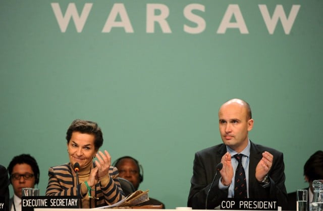 UNFCCC Secretary Christiana Figueres (L) and Polish Environment Minister and COP19 President Marcin Korolec (R) during a meeting at the UN Climate Change Conference in Warsaw, Poland,  November 22.   Photo: EPA/Bartolmiej Zboroski 