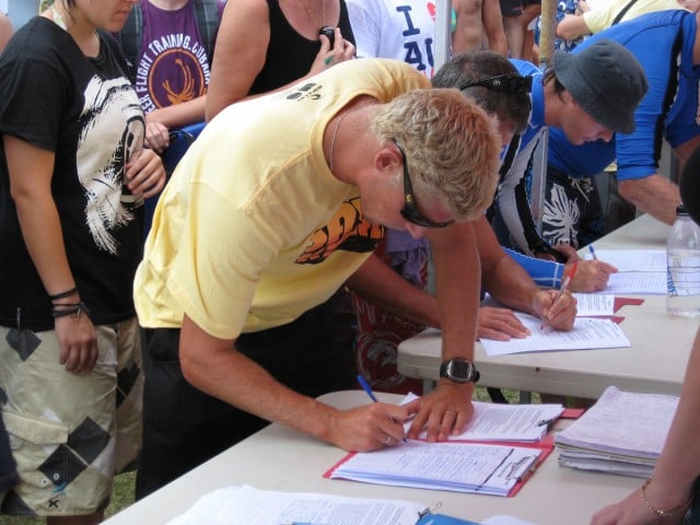 Mick Fanning signs up for 2009 Australia Day Paddle Out at Kirra. Photo Peter 'Joli' Wilson. 
