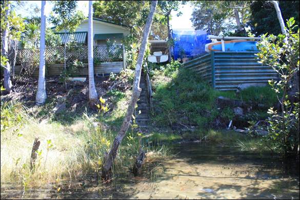 Cabins right on the foreshore at the Terrace caravan park block access along the Simpsons Creek foreshore.