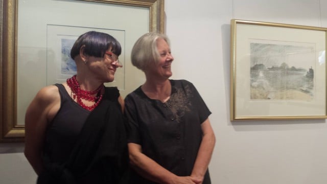 Sisters Ana and Christine Wojak admire some of the works.