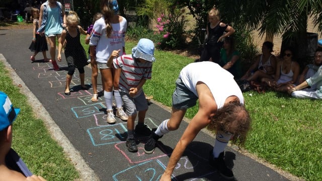 Tommy Franklin and kids try some hopscotch at the Multitask 61st birthday celebrations.