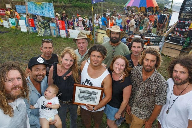 Aussies Against Fracking team Nick Hanlon and Amanda Shoebridge, presented AAF patron, Ash Grunwald with an original Reg Mombassa artwork of Ash surfing the Condamine River in SE QLD.