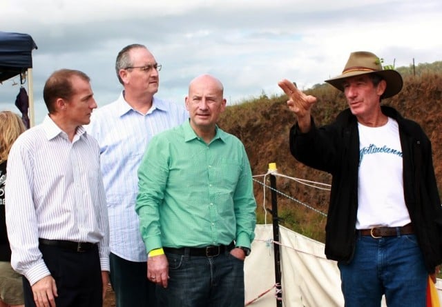 Lock the Gate spokesman Ian Gaillard, right, points to where Metgasco wanted to drill for gas during a visit in May to the Bentley camp by opposition leader John Robertson (green shirt) Lismore Cr Isaac Smith, left, and Labor's north coast spokesman Walt Secord. (file photo supplied