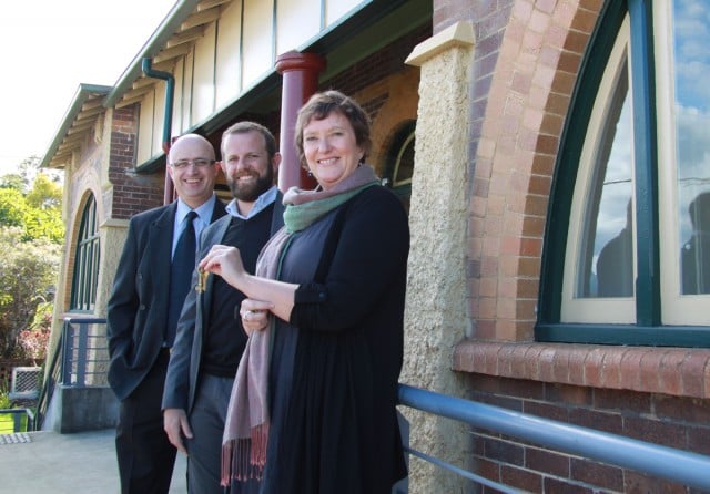 Tweed Regional Museum Director Judy Kean receives the keys from Ware Building representative Matthew Ware (centre), watched by Council General Manager Troy Green.