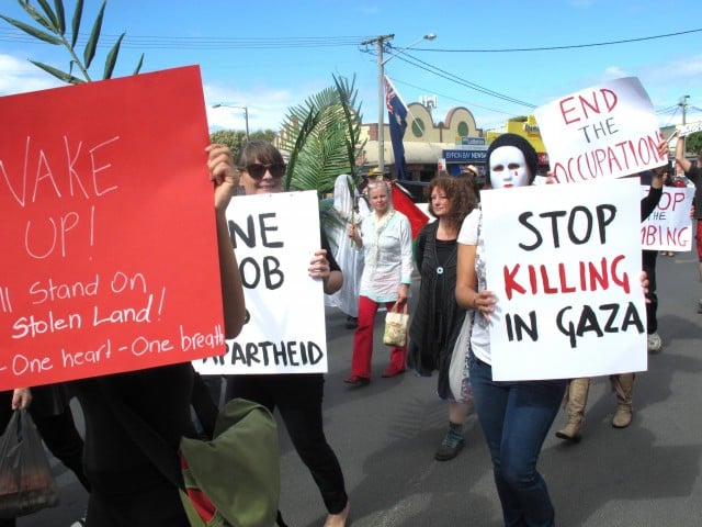 Byron shire residents march against Israel's massacre of Palestinians in Gaza.