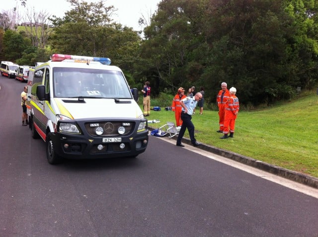 Ambulance paramedics prepare to assist Westpac Life Saver Rescue Helicopter crew transport a critically injured cyclist following an accident in Alstonville this morning.
