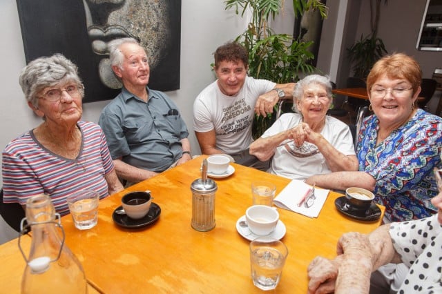 (l-r) Dolphin Cafe owner Edgar Bogic (centre) and Byron Shire Respite Service care manager Barbara Chambers (right) enjoy Christmas brunch at the cafe with day-program participants Morlene Templeman (left), Tom Armstrong and Diana Pysden (second right). Photo Eve Jeffery