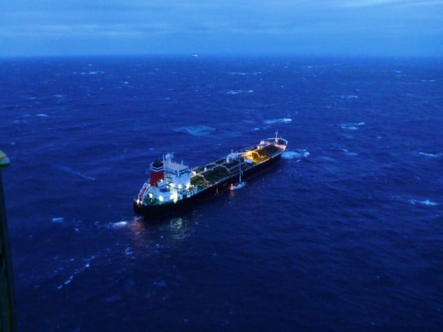 The merchant vessel, British Loyalty, alongside the stricken  yacht Red Sky off Evans Head early this morning (December 12, 2014). Photo Life Saver Rescue Helicopter.