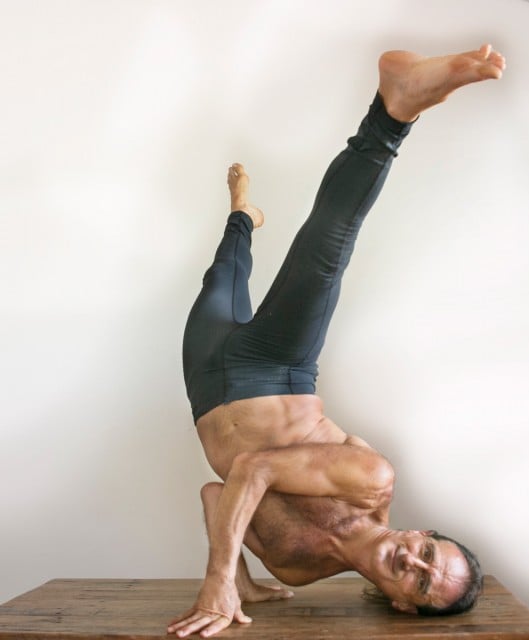 Simon Borg-Olivier shows off a hybrid yoga/capoiera pose. Simon is just one of many yogis featuring at this Saturday’s festival, held at the Byron Public School. Photo Jeff Dawson