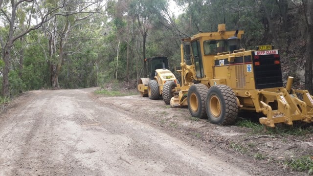 Council road crews regraded the gravel surface of the busy Minyon Falls Road recently after  rain caused more ruts and potholes. 