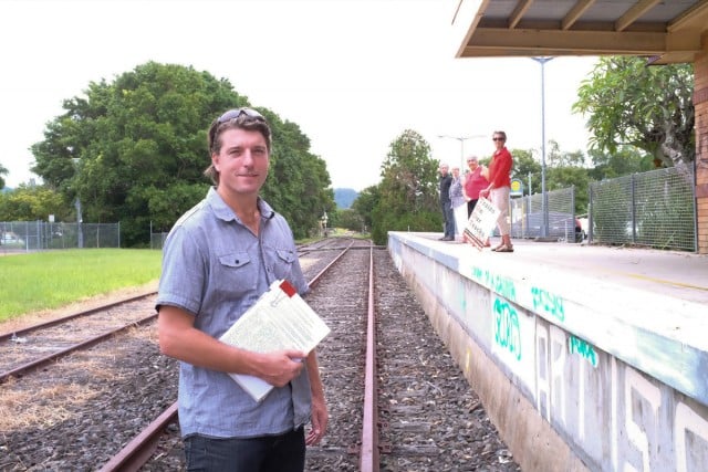 Independent candidate for Ballina, Cr Jeff Johnson, says both a cycle path and public transport can be achieved on the tracks. He is pictured next to a non-political platform at the Mullum Station along with Trains On Our Tracks supporters. Photo Jeff Dawson
