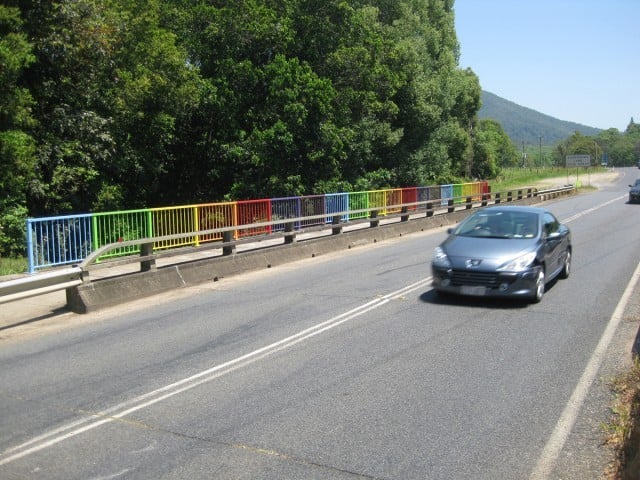 The rainbow-coloured bridge at the northern entry to Uki.