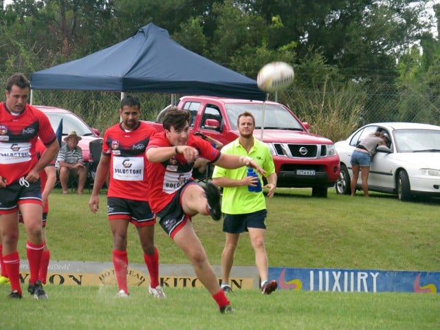 Billy Goldsmith boots downfield for the Devils on Sunday afternoon. Photo John Campbell.