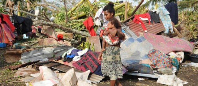 Image from an Oxfam page of a woman and a child in Vanuatu after Cyclone Pam. Photo by Philippe Metois.