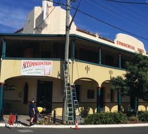 Workers install CCTV cameras outside the Commercial Hotel in Casino. (Supplied)