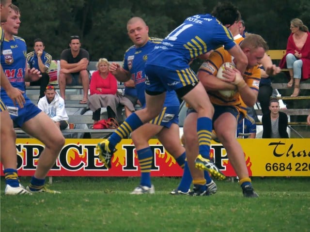 Todd ‘King’ Arthur of the Giants feels the brunt of the Marist defence as Uncle Festus looks on. Photo John Campbell.