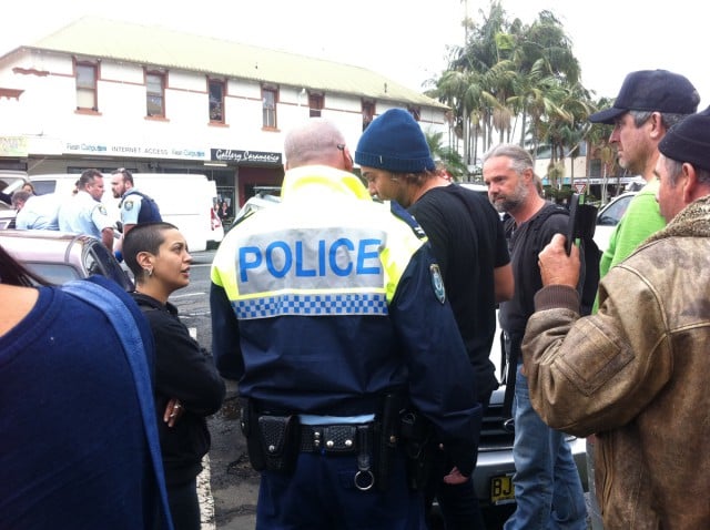 A large crowd gathered around the car at the centre of a police standoff in Mullumbimby's CBD recently, Photo supplied