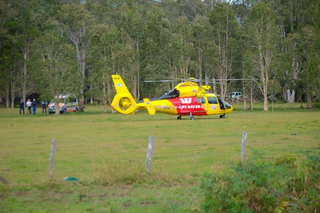 The Life Saver Rescue Helicopter at the site of today's (Tuesday June 23) ultralight crash at Tyagarah. Photo Jeff Dawson