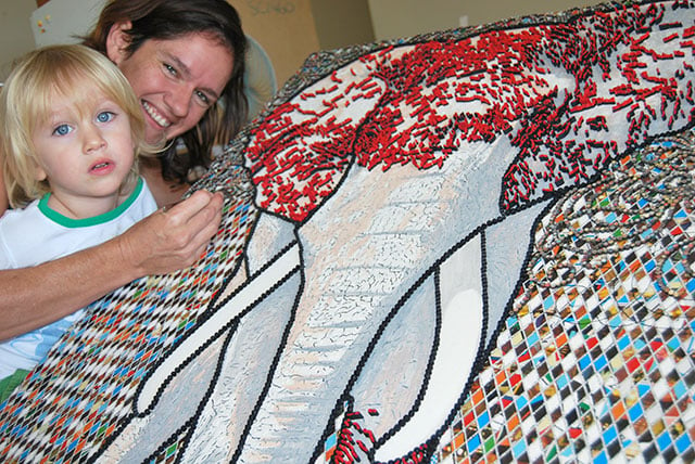 Local artist Melanie Delaney, with son, August, juggles her art career with motherhood.