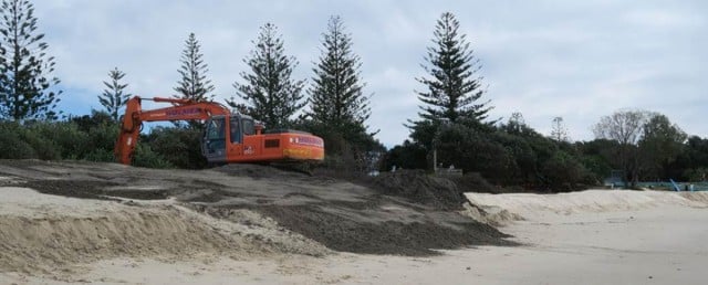 The dredge spoil from the Evans River is dumped and spread on the beach.