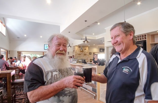 Mt Warning Hotel licensee Geoff Brown, right, and cellarman, Chris Roodes, toast the re-built pub at Uki which will be officially opened tomorrow (Saturday). Photo Jeff Dawson
