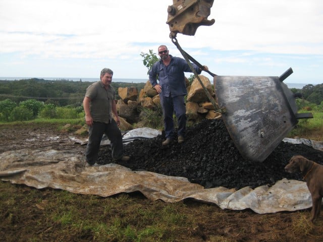 Don Coyne, left, and Kelvin Daly with the finished product: a large pile of valuable ‘black gold’, or biochar. 