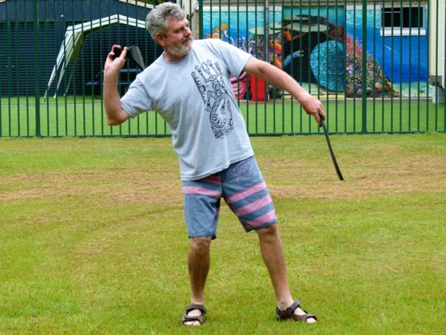 Chris Hauritz, principal of the Ocean Shores Public School, tries his hand at mullet tossing. Photo contributed