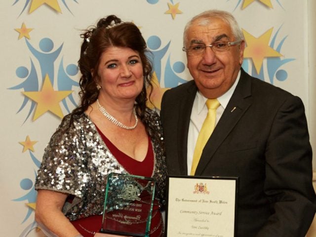 Murwillumbah and District Business Chamber president Toni Zuschke receives her Premier's Award from Lismore MP Thomas George. Photo Vibrant Imaging