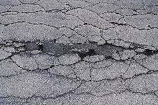 Asphalt laid by dodgy tradesmen often does not last very long.