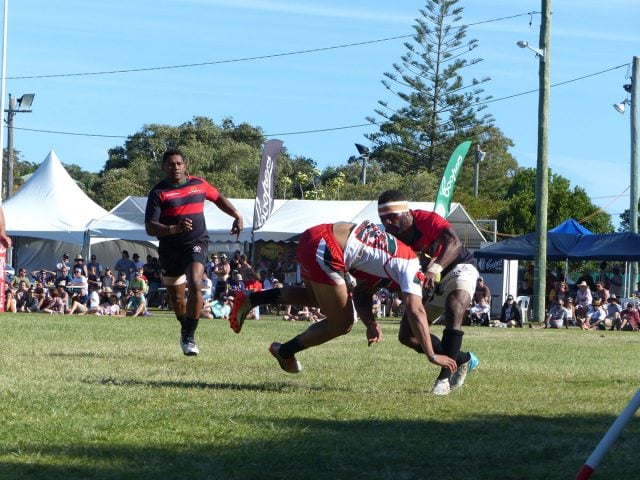 Gritty defence from the Melville 7s rugby side (red and white) helped them win the contest Photo Anthony Smith