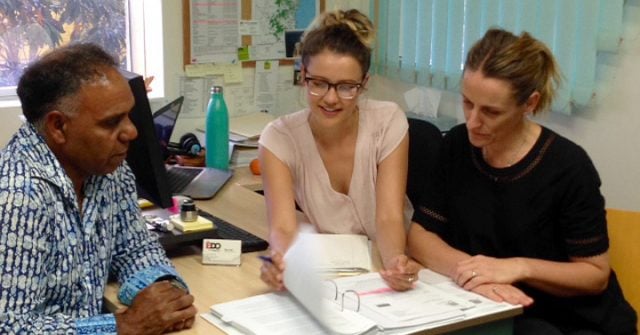 Gidubul Elder Rob Williams discusses his case with solicitor Nina Lucas and CEO Sue Higginson at the Northern Rivers office.