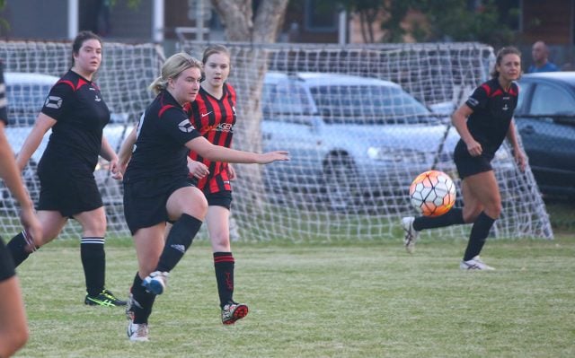 Byron’s Salem Edwards has a crack at goal. Photo Dogwhistle