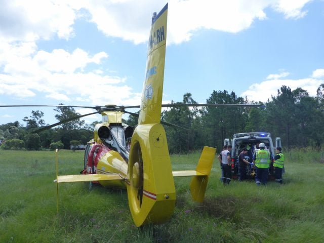 The Westpac Lifesaver Rescue Helicopter prepares to airlift the injured driver. (supplied)