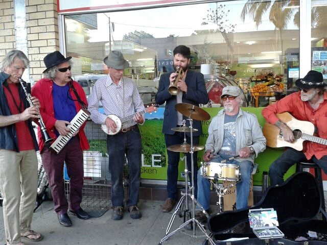 The Codgers playing outside Dennet's supermarket in Mullumbimby. Photo supplied. 