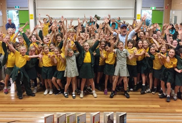 Author Tristan Bancks gets among the kids from Bangalow Primary. Photo supplied 