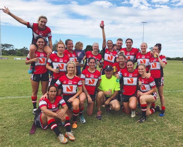 The She-Devils (and coach) celebrate an undefeated run in the new women’s tag-league competition. Photo supplied