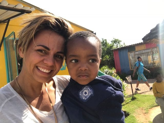 Jen Kyna with one of the children who is supported by the Kindling project. Photos supplied