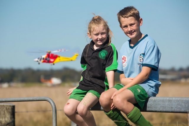 Bailey and Madison from Rock Valley were amazed on their way home from soccer, when Paul Bennet in his amazing Wolf Pitts flew above and the Westpac Rescue Helicopter hovered below. Photo Tree Faerie.