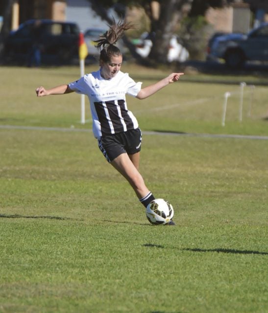 Isabella ‘Bella’ Leckie (U/16) leans into a cross in the women’s youth summer league. Photo supplied