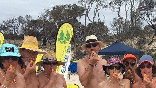 Attendees at Byron's inaugural Nude Olympics on Saturday (October 7) 'blowing the whistle on sexual assault.' Photo supplied