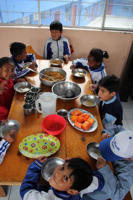 The children enjoying their daily meal. Photo supplied. 