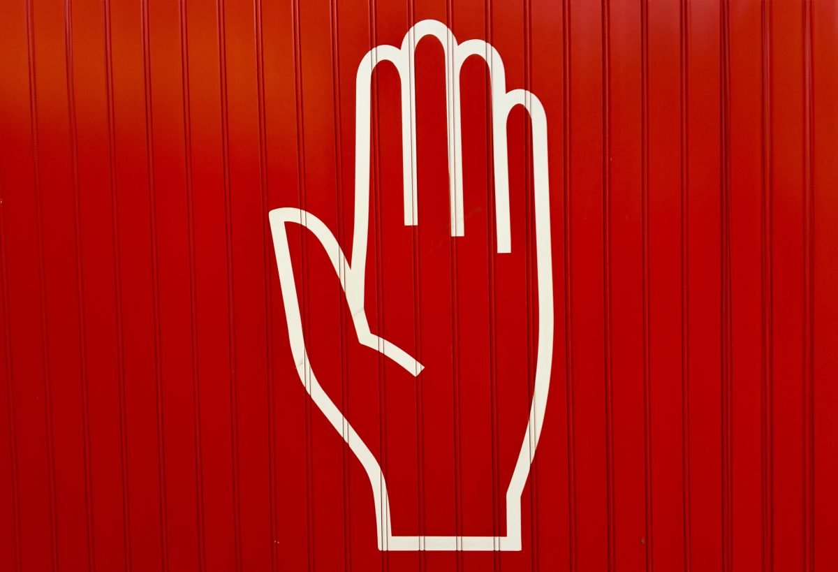 White hand on red