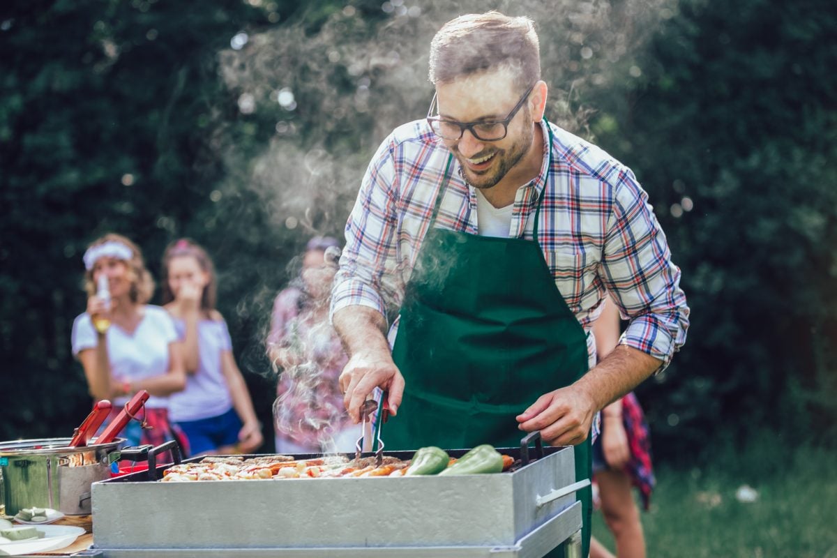 man cooking with BBQ